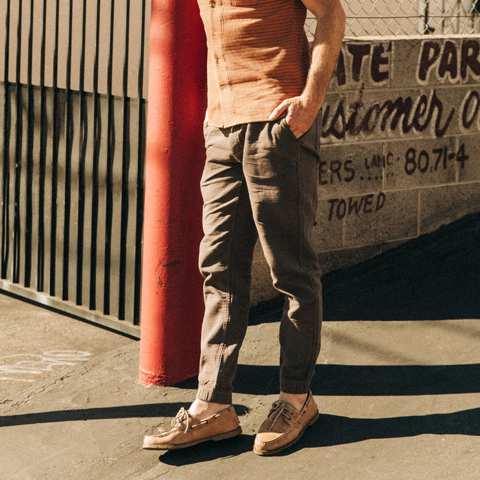 fit model on a sunny street in The Apres Pant in Walnut Double Cloth