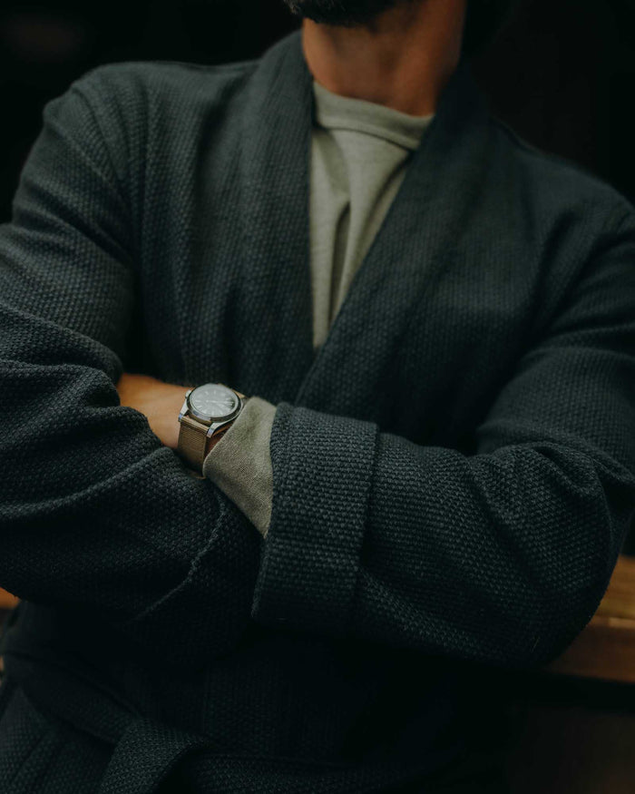 fit model with his arms crossed wearing The Apres Robe in Navy Sashiko