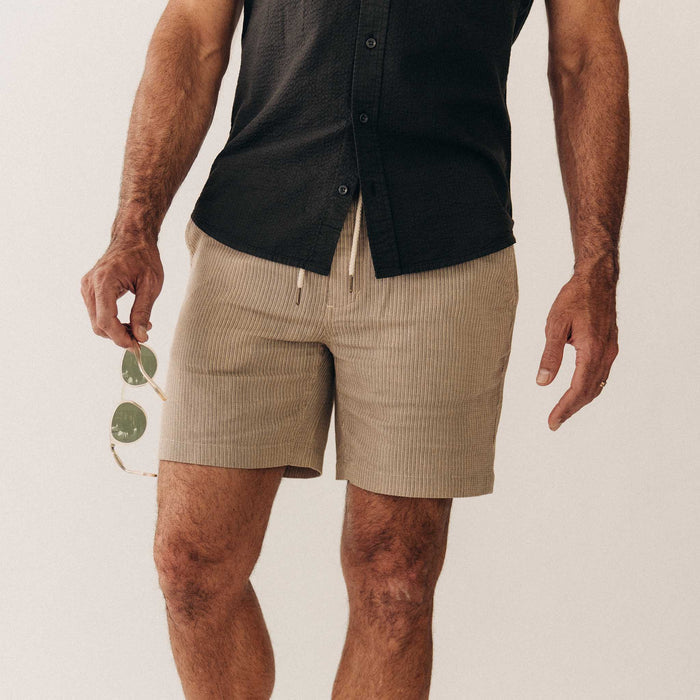 fit model showing off The Apres Short in Black Coffee Stripe