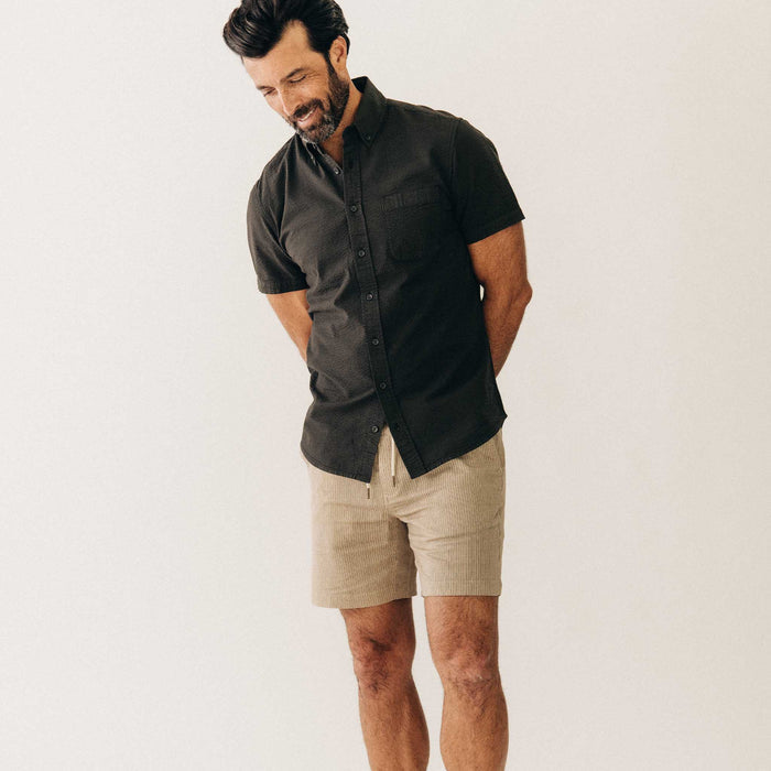 fit model posing in The Apres Short in Black Coffee Stripe