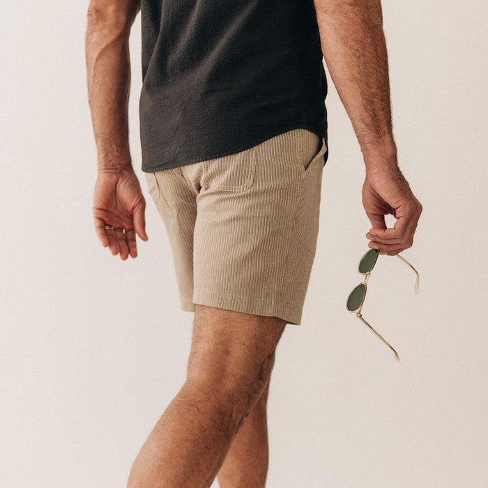 fit model showing off the back of The Apres Short in Black Coffee Stripe