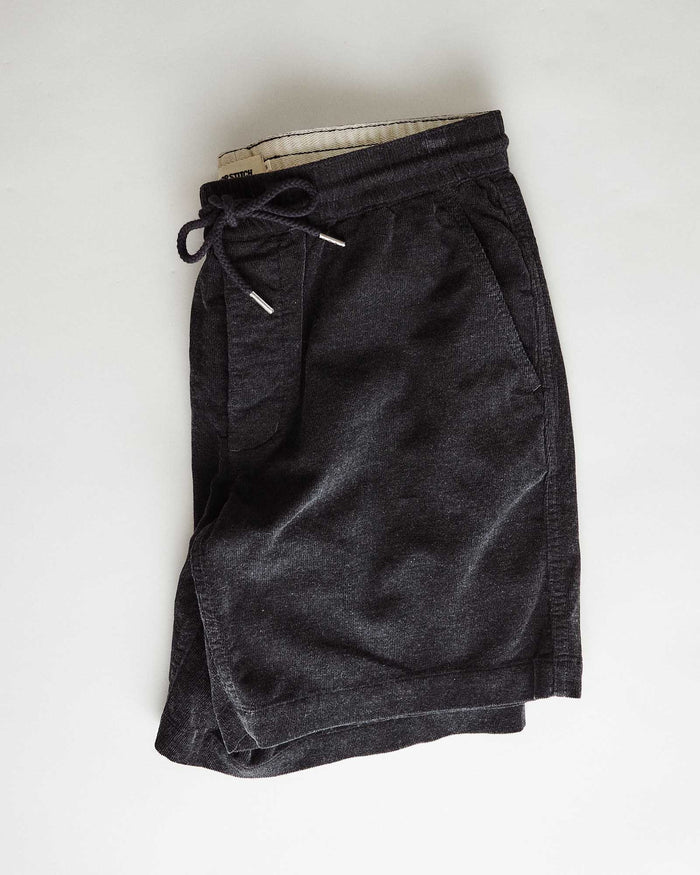 editorial flatlay of The Apres Short in Heather Coal Pincord
