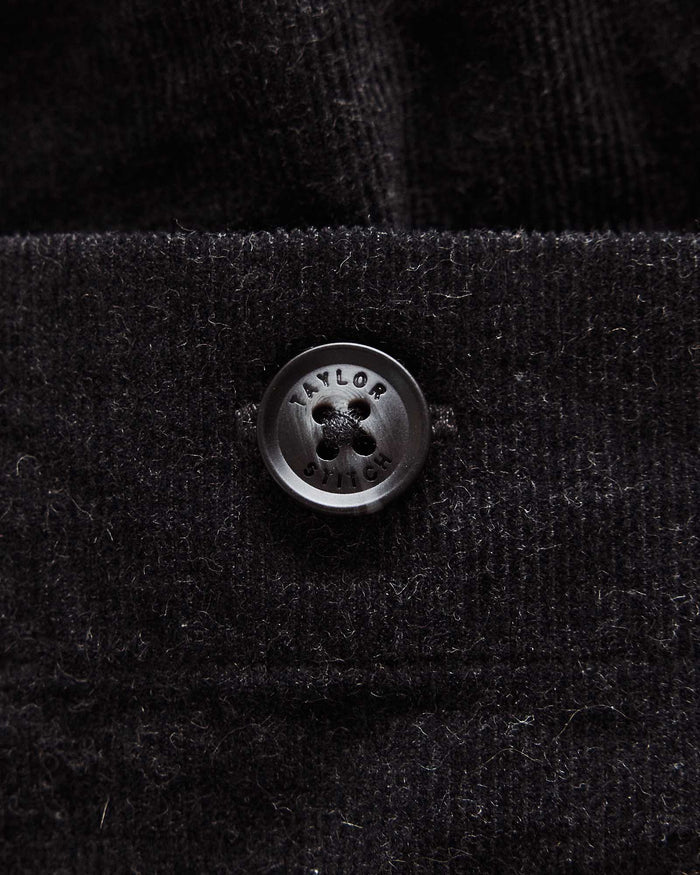 material shot of the button on The Apres Short in Heather Coal Pincord