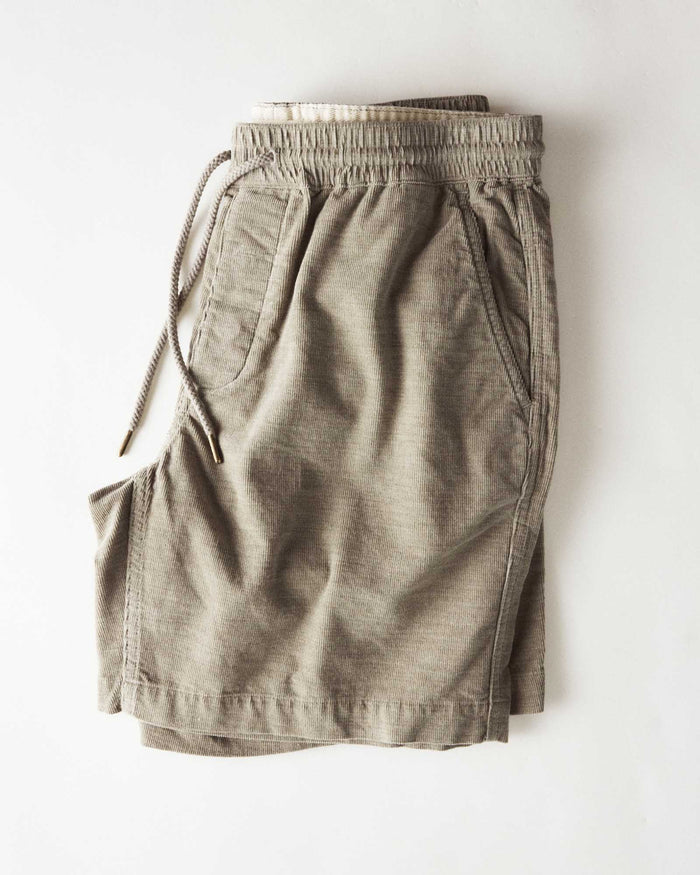 folded flatlay of The Apres Short in Heather Moss Pincord