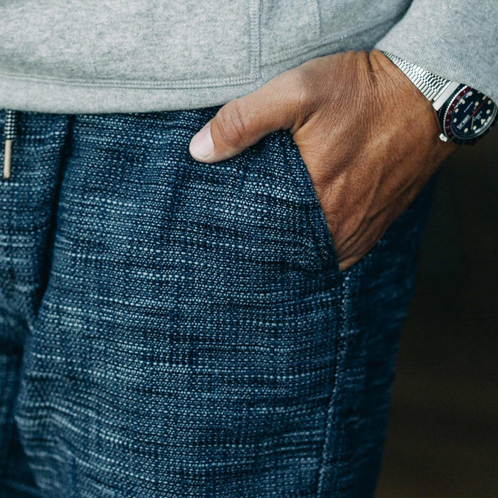 our fit model wearing The Après Short in Indigo Slub—wearing a hoodie early in the morning, cropped shot of pocket detail