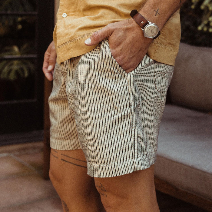 fit model showing the side of The Apres Short in Morita Stripe