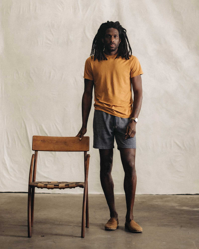 fit model posing in The Apres Short in Navy Linen Tweed