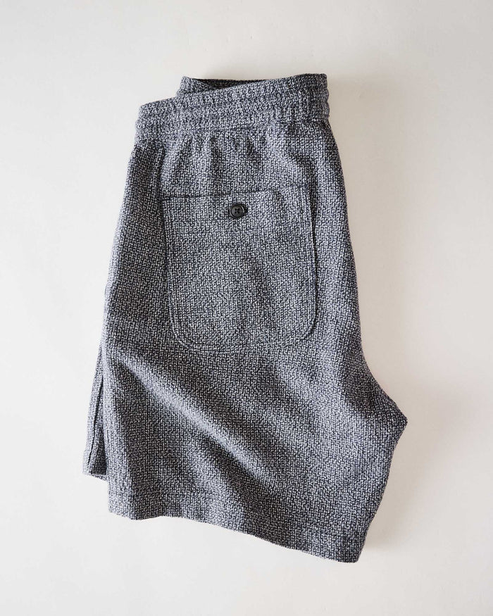 flatlay of the back of The Apres Short in Navy Linen Tweed folded