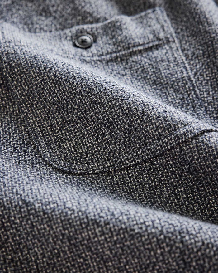 material shot of the back pocket on The Apres Short in Navy Linen Tweed