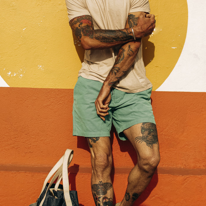 fit model crossing his arms and posing in The Après Short in Ocean Pinwale