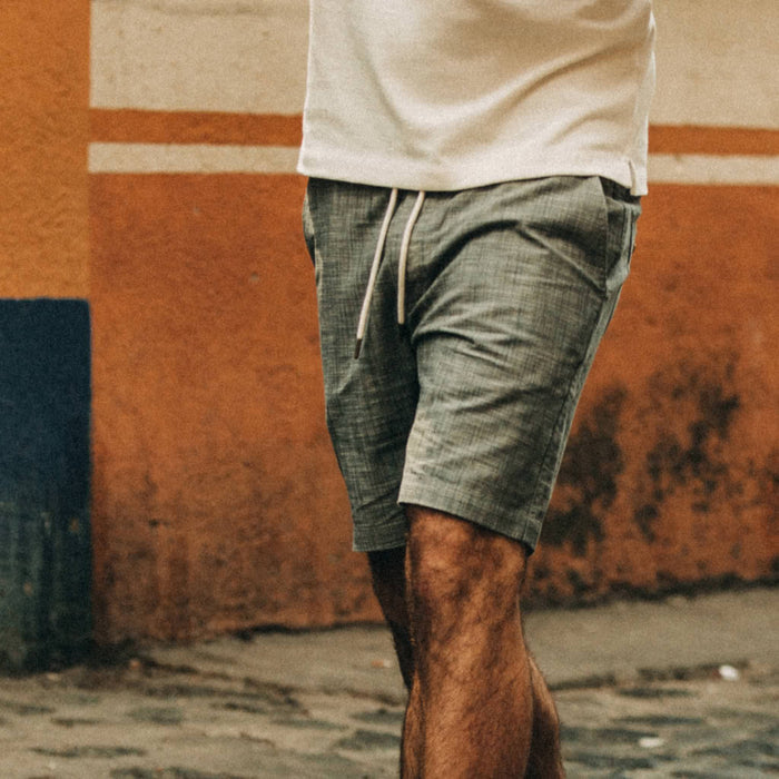 fit model wearing The Apres Short in Olive Pin Dot, cropped chest down