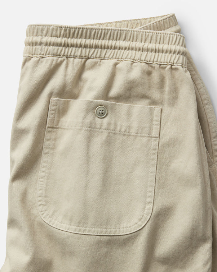 material shot of the back of The Apres Short in Organic Aged Stone Foundation Twill