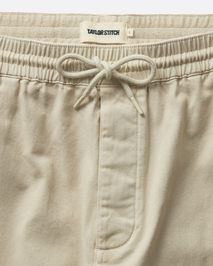 material shot of the waistband on The Apres Short in Organic Aged Stone Foundation Twill