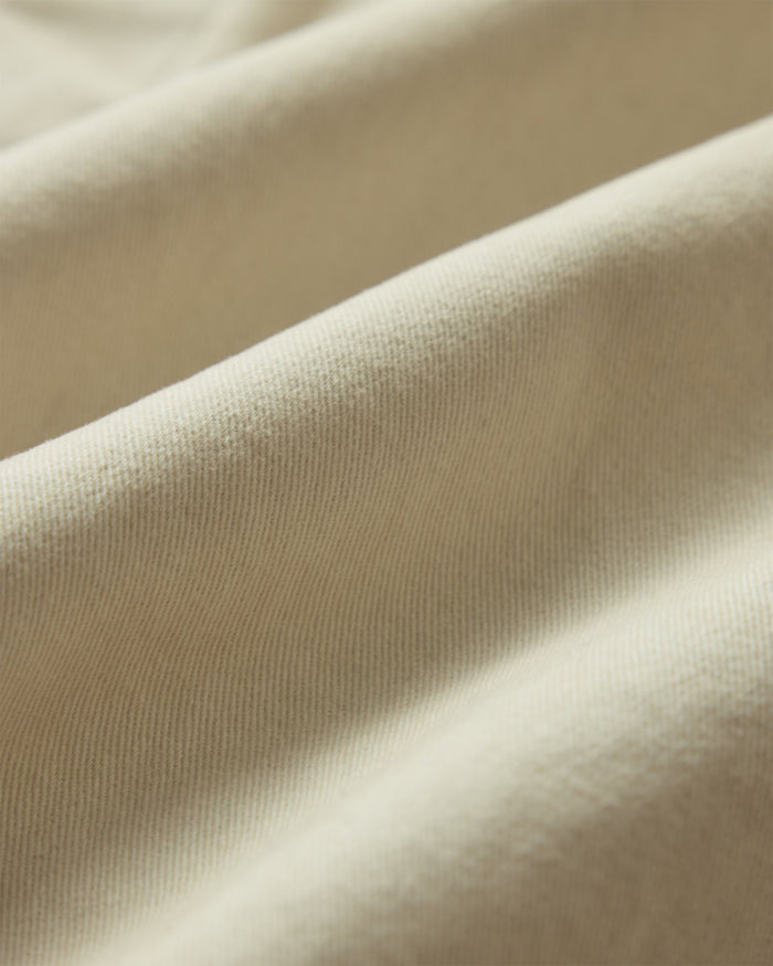 material shot of the fabric on The Apres Short in Organic Aged Stone Foundation Twill