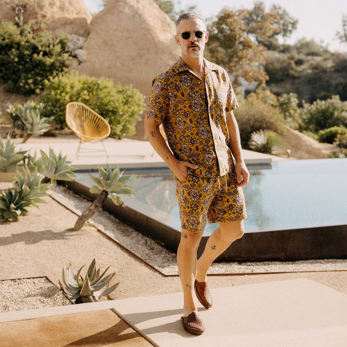 fit model posing in The Apres Short in Tarnished Gold