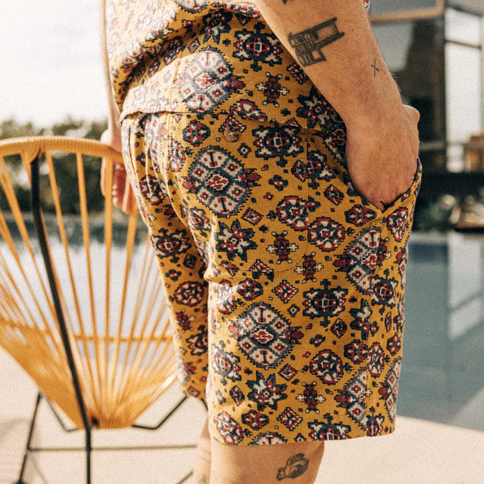 fit model showing off the back pocket of The Apres Short in Tarnished Gold