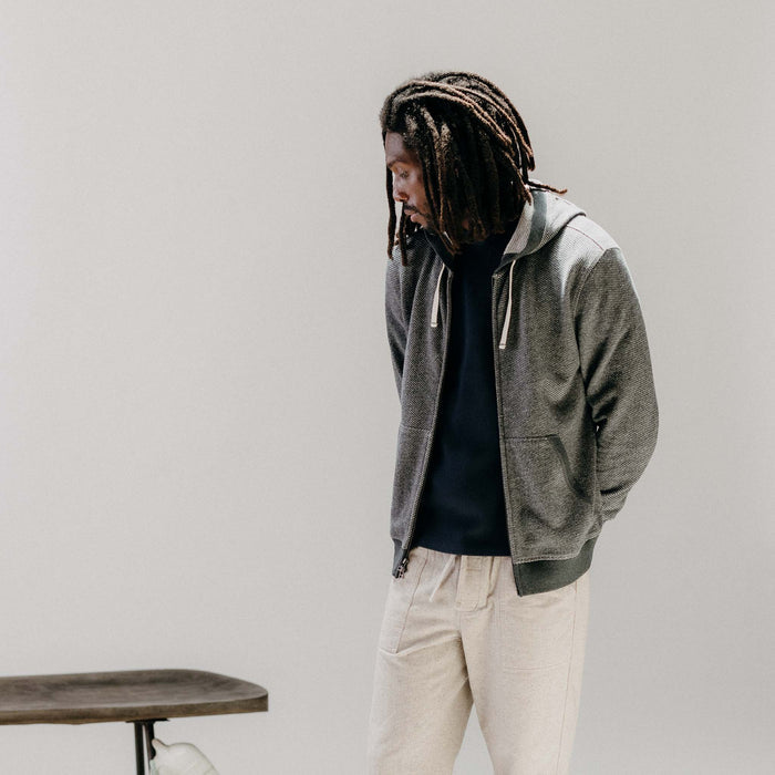 fit model posing wearing The Apres Zip Hoodie in Graphite French Terry Twill
