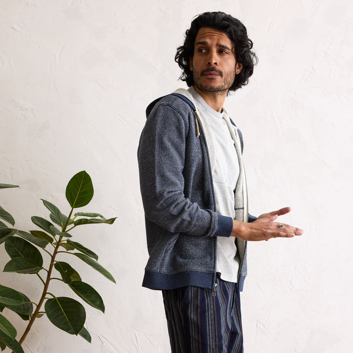 fit model in The Apres Zip Hoodie in Heather Navy Terry