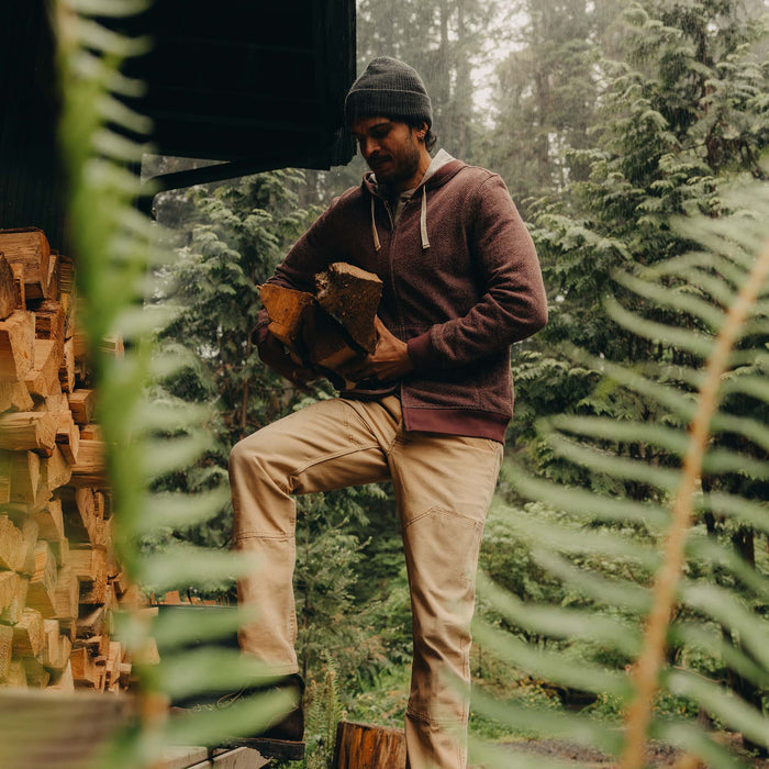 fit model stacking wood wearing The Apres Zip Hoodie in Merlot French Terry Twill