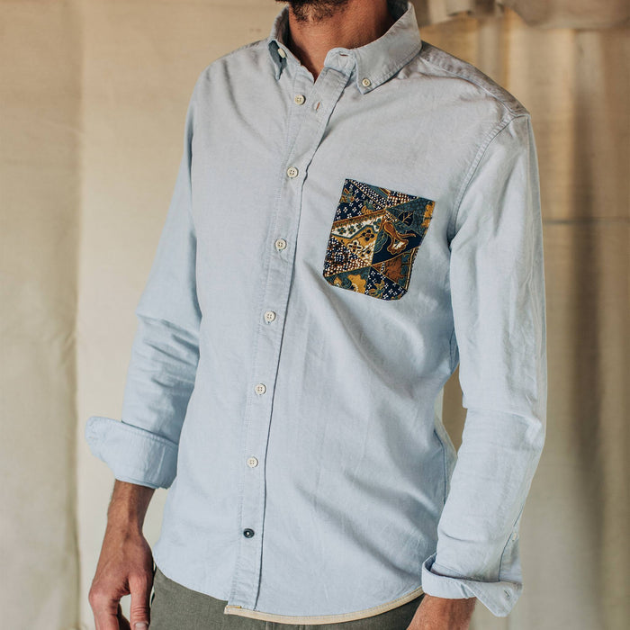 fit model wearing The Atelier and Repairs Jack in Washed Blue Oxford, cropped neck down