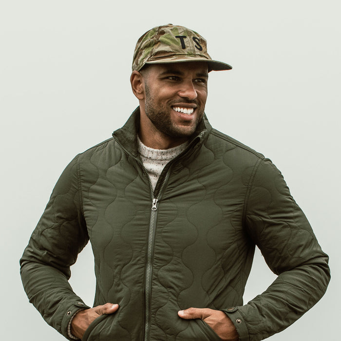 our fit model wearing The Ball Cap in Arid Camo