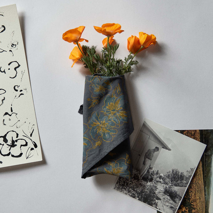 editorial image of The Bandana in Dark Blue Floral wrapped in flowers