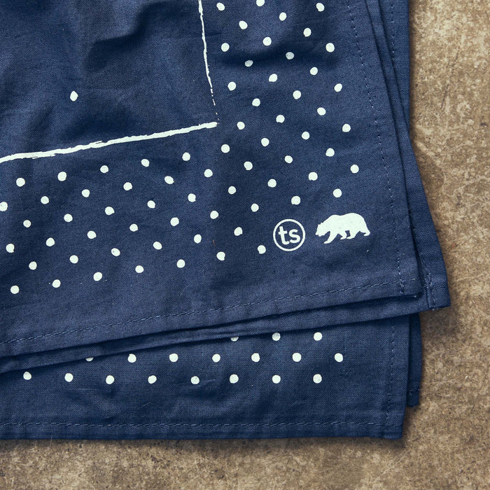 folded flatlay of the logo on The Bandana in Heritage Blue