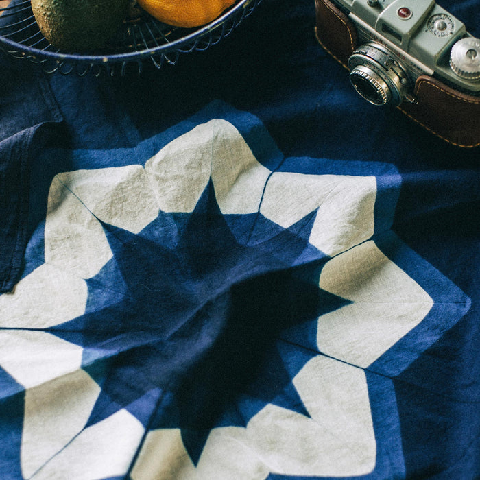 material shot of The Bandana in Natural Indigo Geo laid flat