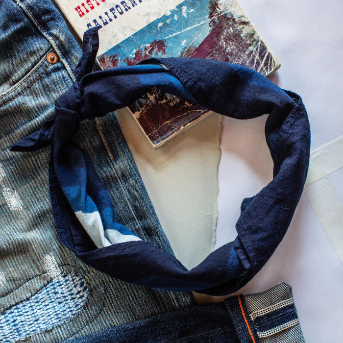 material shot of The Bandana in Natural Indigo Petal with its ends tied together.