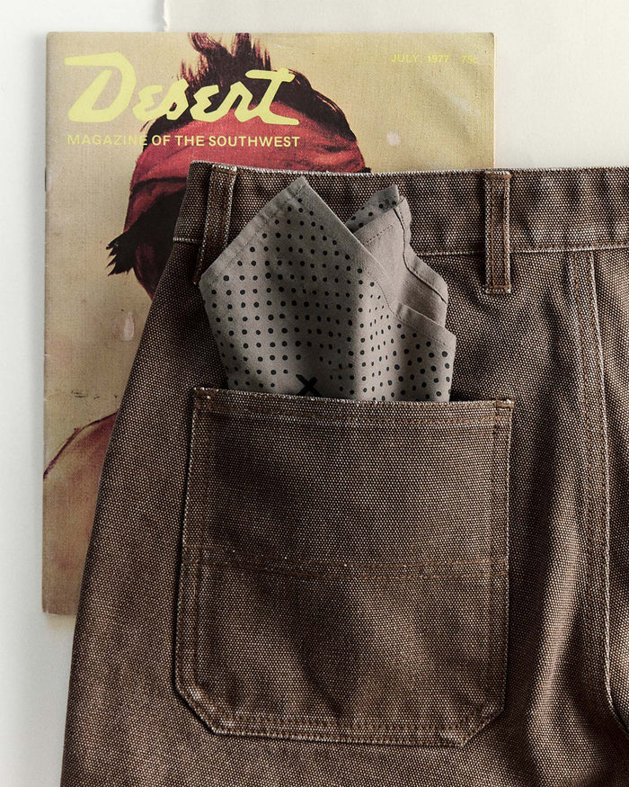editorial image of The Bandana in Smoked Olive Pindot in a pants pocket