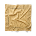 flatlay of The Bandana in Tarnished Gold
