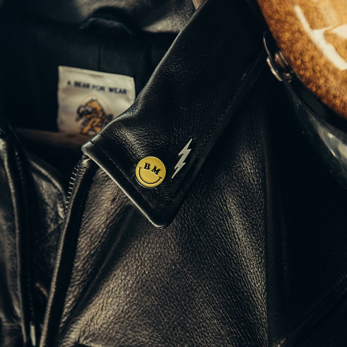 material shot of the bolt enamel pin on jacket