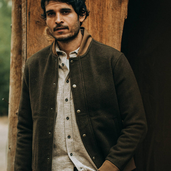 fit model wearing The Bomber Jacket in Olive Wool, looking ahead