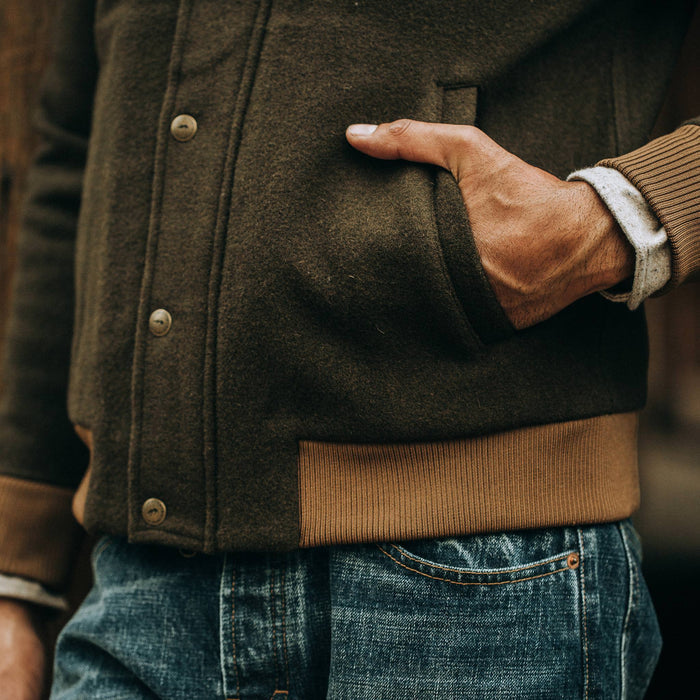 fit model wearing The Bomber Jacket in Olive Wool, hand in pocket