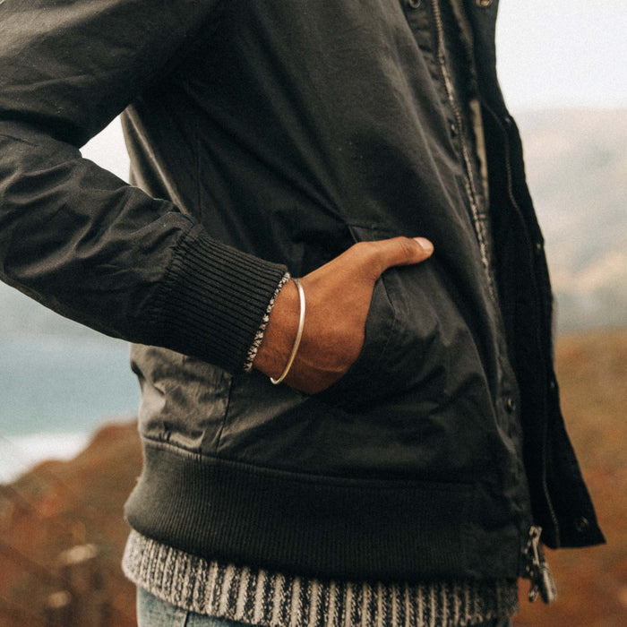 fit model with hand in pocket of The Bomber Jacket in Waxed Navy