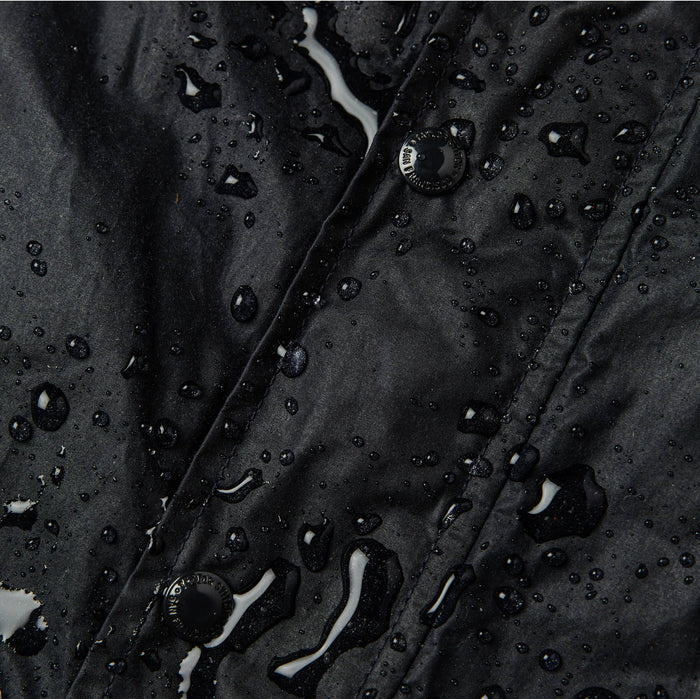 material shot of water on front placket showing weatherproofing of wax treatment