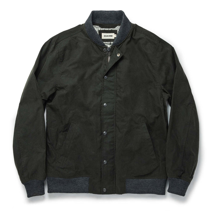 flatlay of The Bomber Jacket in Waxed Olive closed from the front
