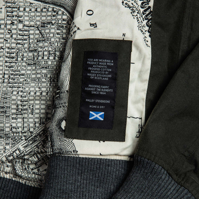 material shot of The Bomber Jacket in Waxed Olive with halley stevensons waxed label