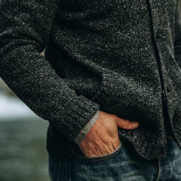 fit model wearing The Bomber Sweater in Black Sesame, hand in pocket