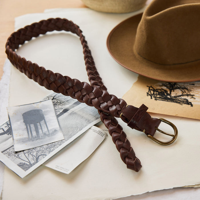 editorial image of The Braided Belt in Dark Brown laid out on paper