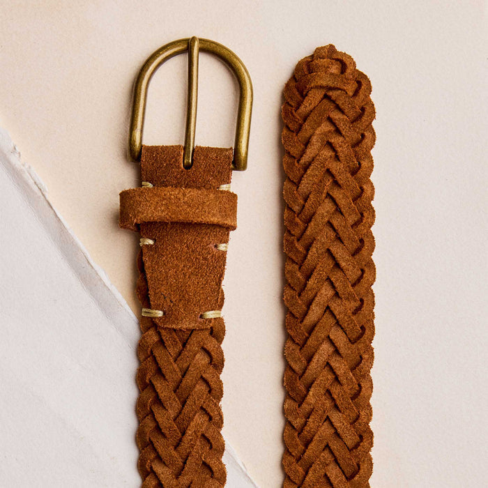 editorial image of the buckle and back of The Braided Belt in Tan Suede