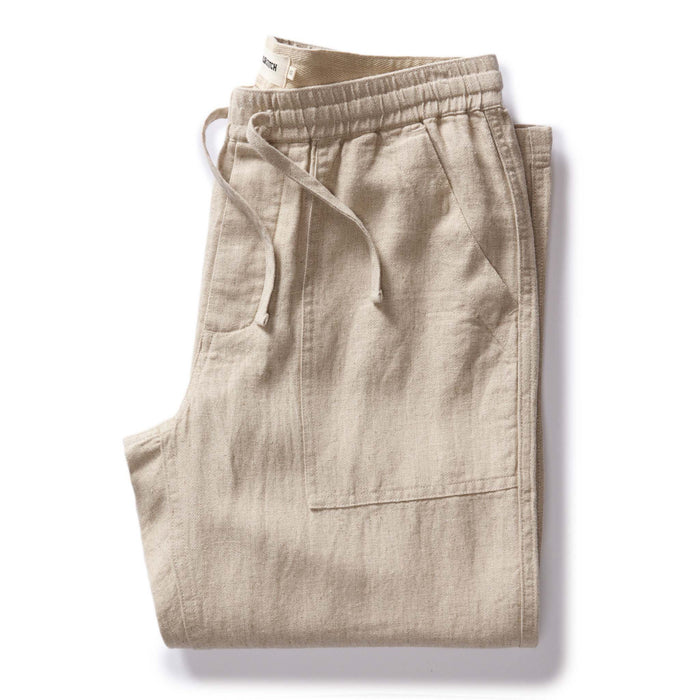 folded flatlay of The Breakwater Pant in Natural Herringbone