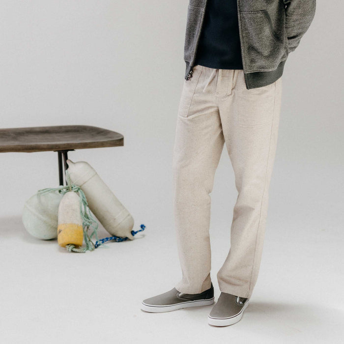 fit model showing off The Breakwater Pant in Oat Donegal