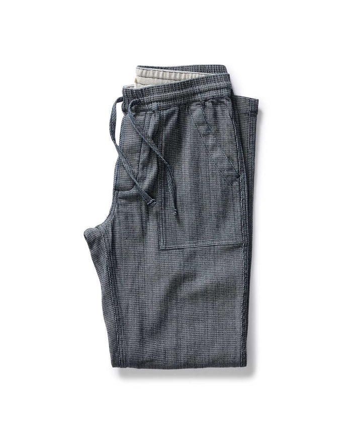 folded flatlay of The Breakwater Pant in Rinsed Indigo Stripe