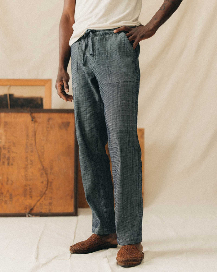 fit model posing in The Breakwater Pant in Rinsed Indigo Stripe