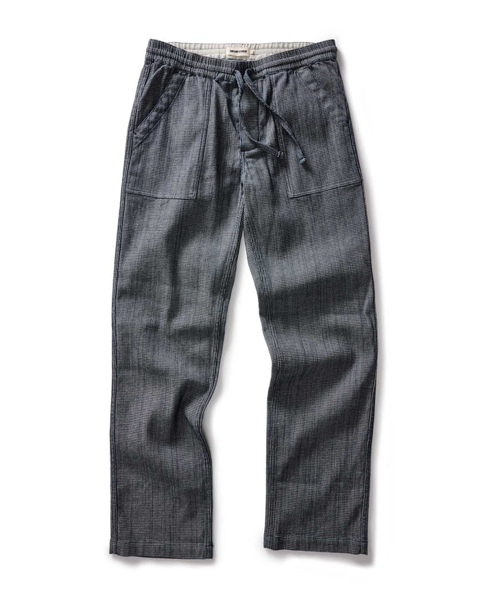 flatlay of The Breakwater Pant in Rinsed Indigo Stripe