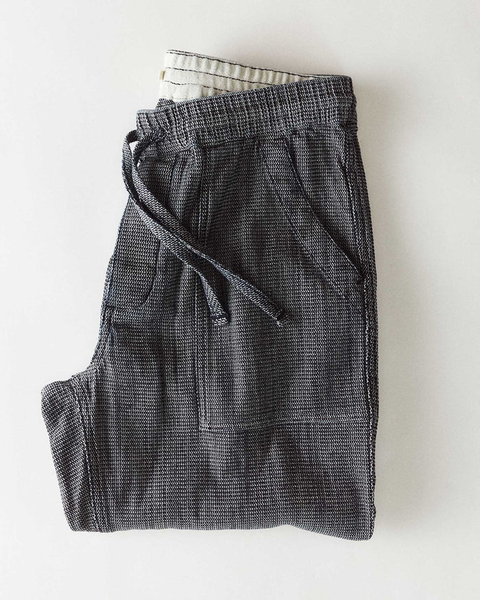 folded flatlay of The Breakwater Pant in Rinsed Indigo Stripe