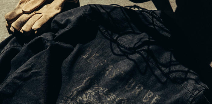 workshop header [tl] flatlay of shop shirt next to gloves