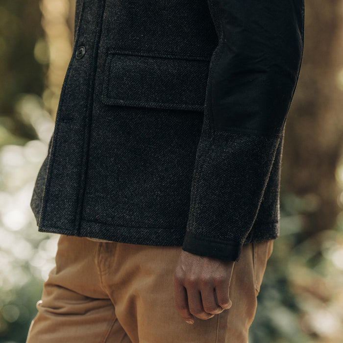 fit model showing off the bottom detail on The Bunker Jacket in Coal