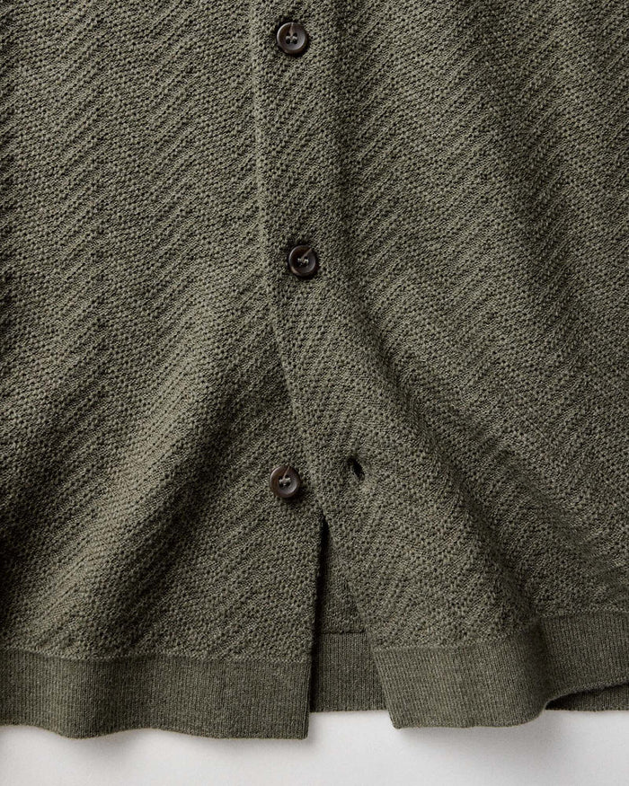 material shot of the buttons on The Button Down Polo in Cilantro Herringbone